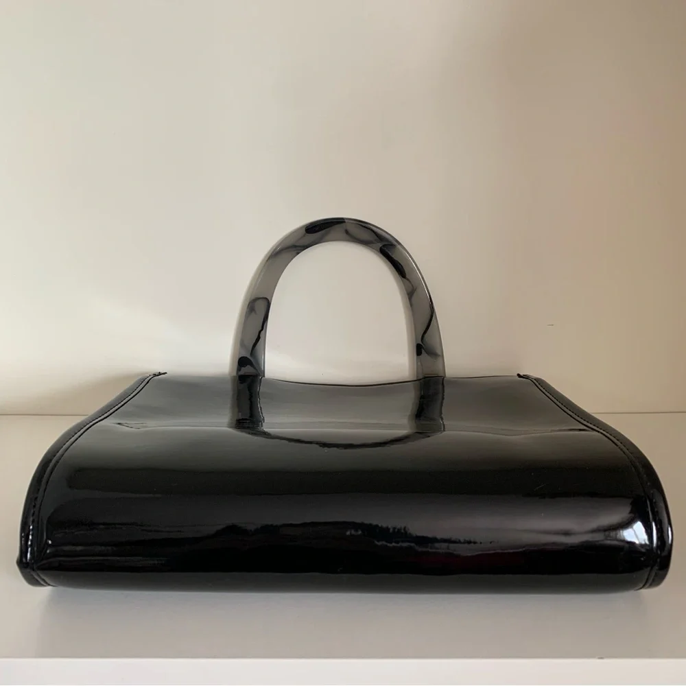 Hold NWOT Neiman Marcus black patent marble handle modern bag